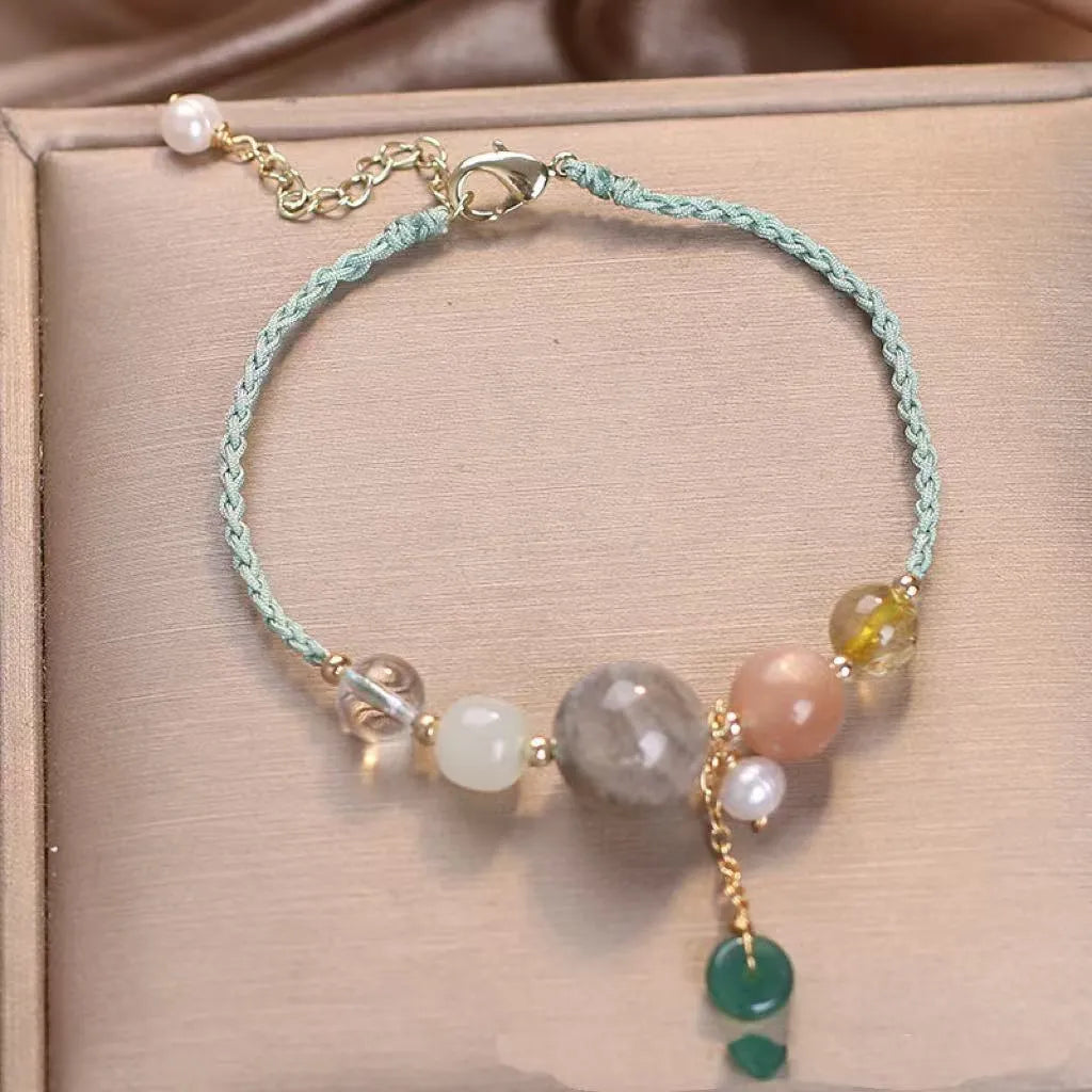 Hand-woven women's crystal bracelet with peace buckle clasp and sequin accents
