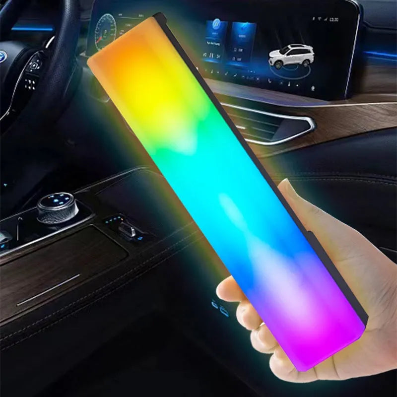 3D RGB music rhythm table lamp with voice control in black or white shell on a desk.