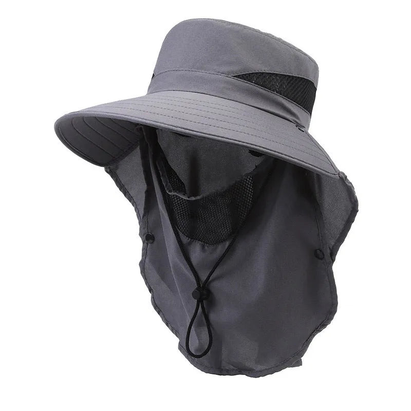 Men's grey fisherman hat with wide brim, shown from the side on a wooden post outdoors.