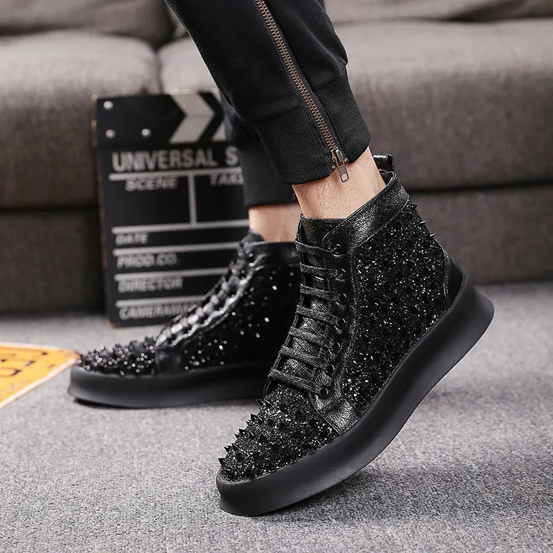 Men's black cowhide leather Martin boots with round toe and rivet detail on a flat surface