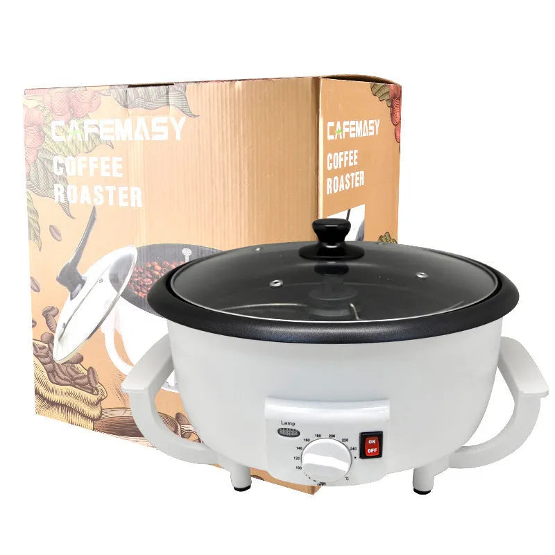 White oblate home coffee bean roasting machine with 750g capacity on a kitchen counter