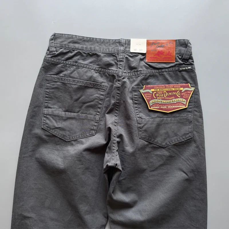 Men's straight-leg cotton casual trousers in grey, army green, and khaki colours on a mid waist fit model