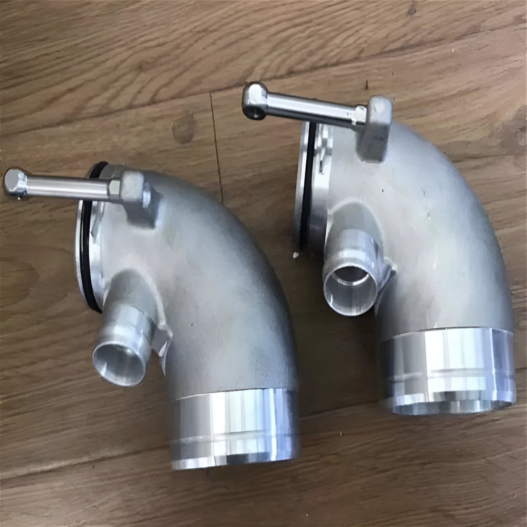 Aluminium alloy turbocharger pipe elbow with a 90-degree bend for lateral engine applications