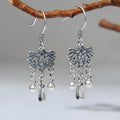Pair of handmade 925 sterling silver koi earrings with silver colour and drop ear hook design