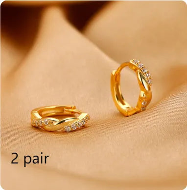 Women's gold geometric clip-on earrings with an interwoven hemp rope design.