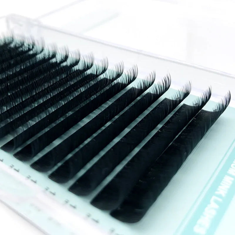Pair of soft artificial fibre velvet false eyelashes showing curl and length options.