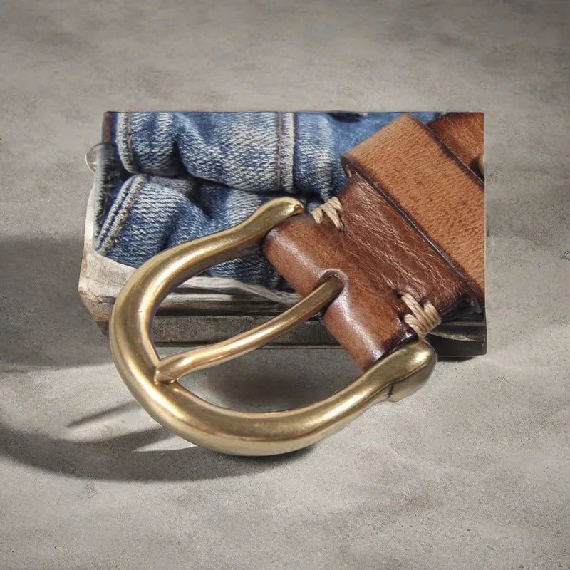 Men's brown casual leather belt with a copper pin buckle shown on a pair of jeans