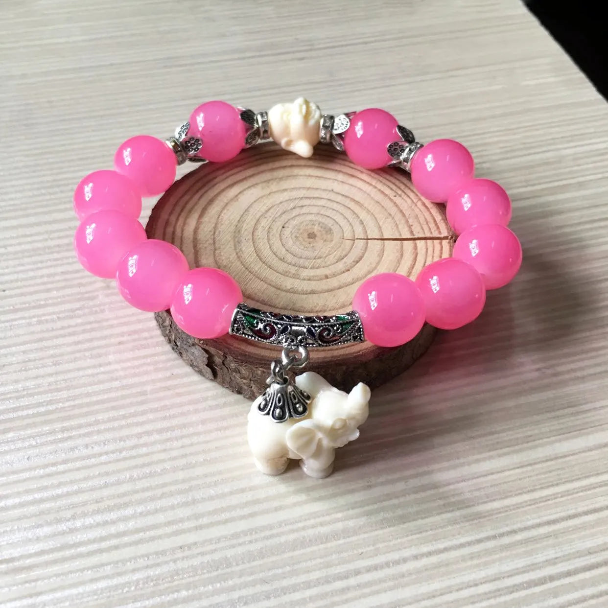 Crystal elephant charm bracelet with clear beads and gold finish metal charm
