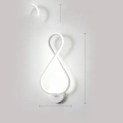 Nordic minimalist LED wall lamp with silicone shade in black finish on a white wall.