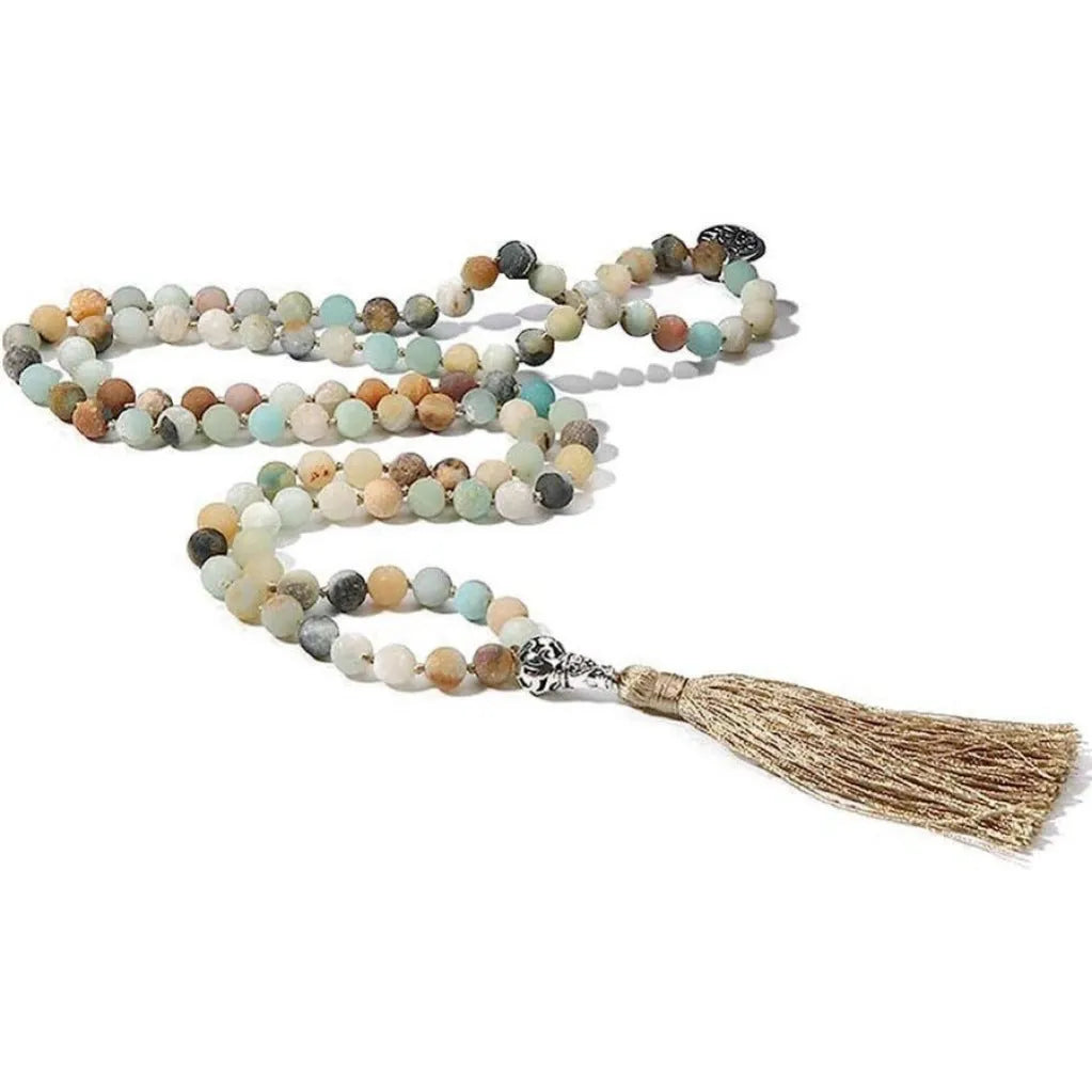 Handmade knotted stone bead necklace with 108 beads, showing geometric design and natural stone colours.