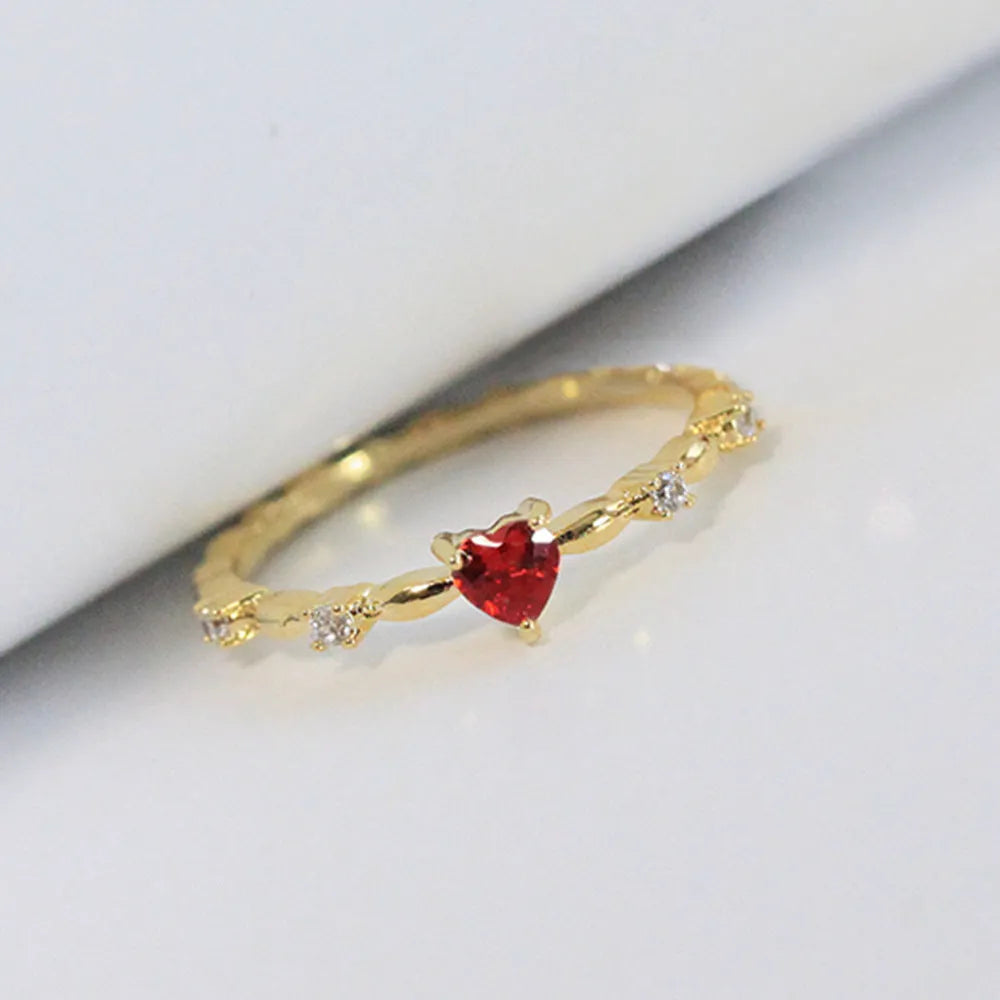 Personalised gold or silver plated ring with a peach heart charm and clear zircon stones.