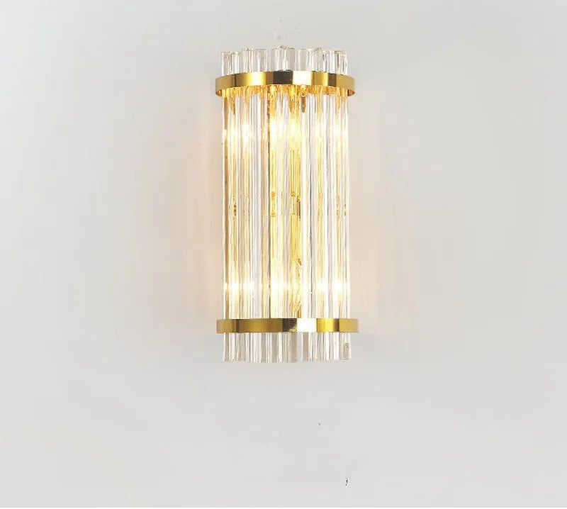 Modern crystal wall lamp with petal design and titanium gold finish mounted on wall