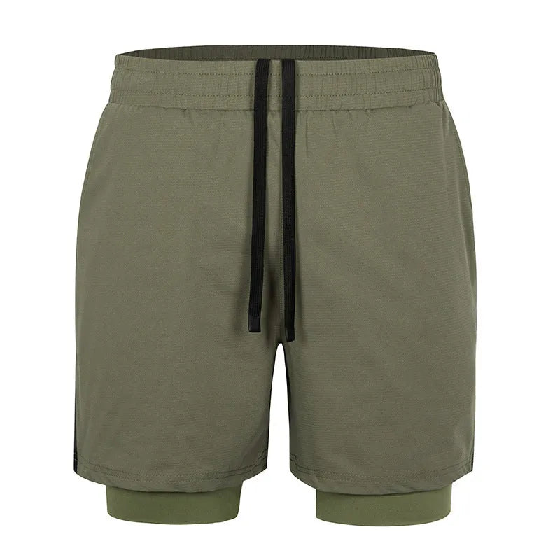 Man wearing quick-drying plaid sports shorts in army green, showing mid waist and shorts length.
