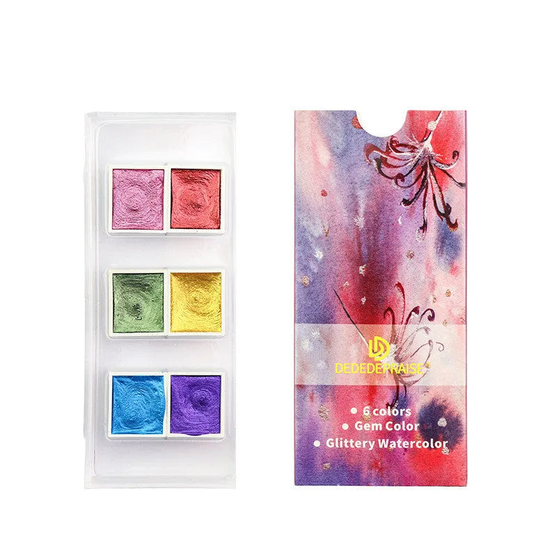 Boxed set of solid watercolour pigment blocks in pearlescent colours on a white background.