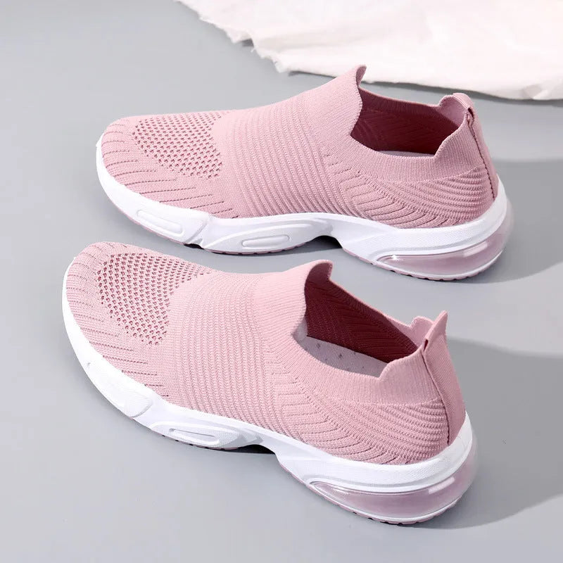 Lightweight black slip-on sock shoes with a low-top design and textured PVC sole.