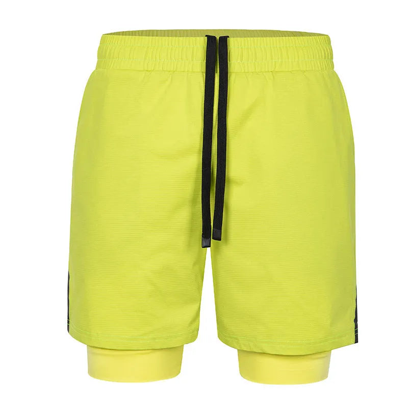 Man wearing quick-drying plaid sports shorts in army green, showing mid waist and shorts length.