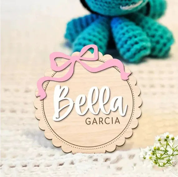 Square wooden baby room ornament with custom name engraving for nursery decor.