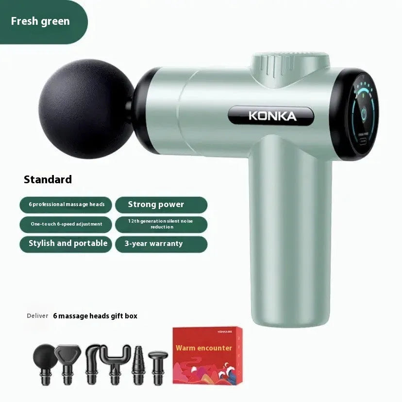 Konka V19 grey massage gun with multiple silicone attachment heads on a table.