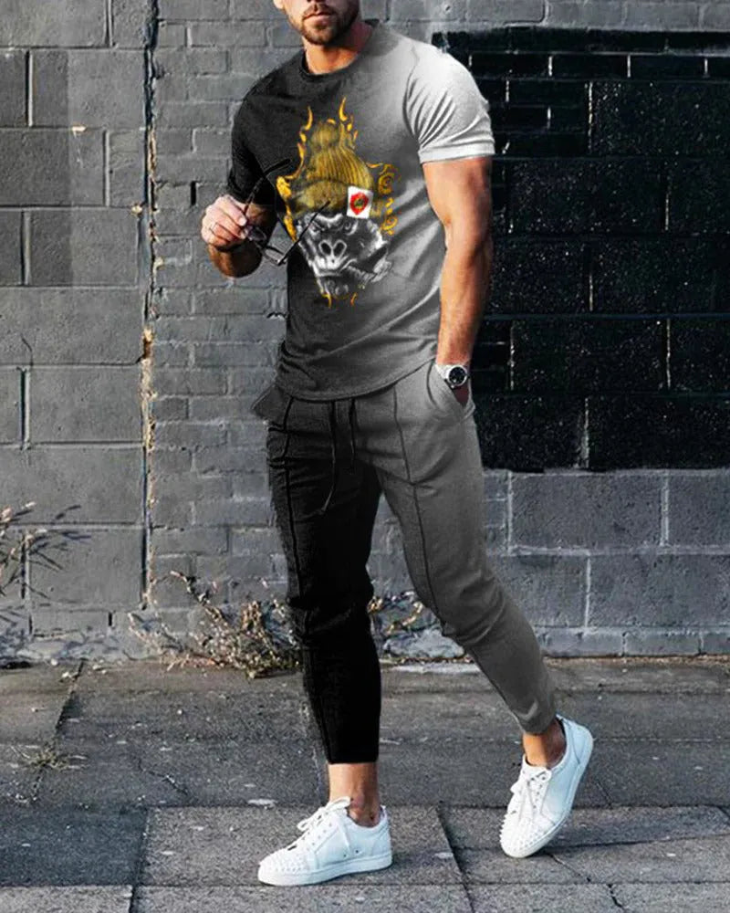Men's thin short-sleeve printed pullover and matching trousers tracksuit set on a hanger.