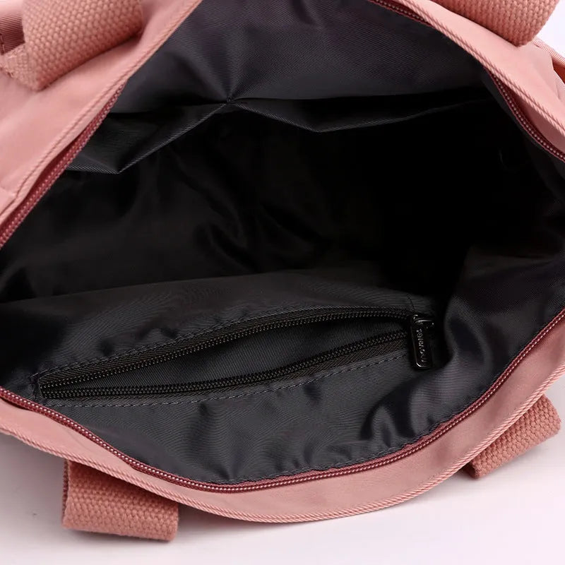 Women's large capacity multi-interlayer shoulder bag in nylon, soft horizontal square shape with sewing line detail, multiple internal compartments, urban simplicity style
