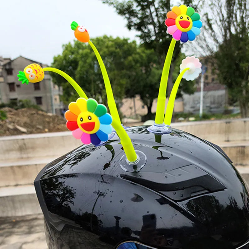 Yellow silicone sunflower decoration with suction cup base for helmets and dashboards.