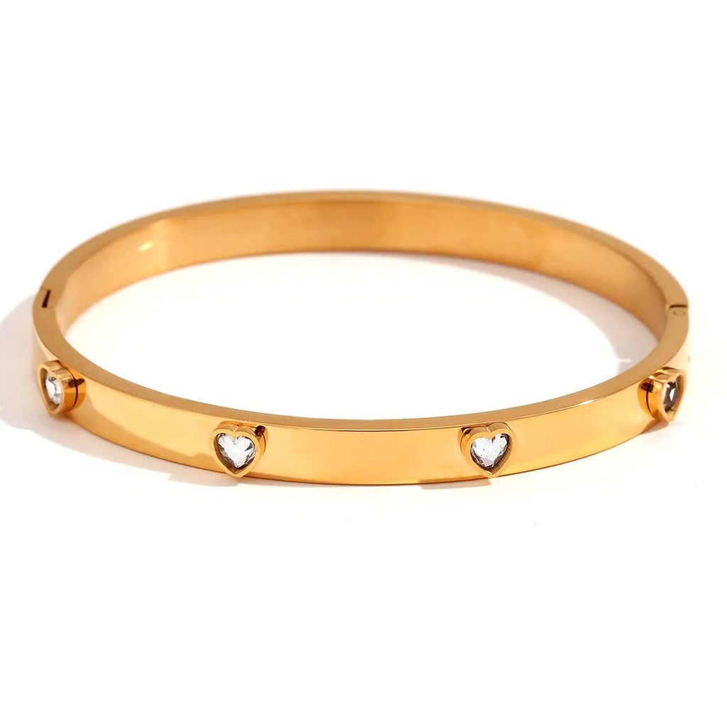Gold electroplated stainless steel bracelet with micro-inlaid peach heart design and diamond accents
