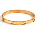 Gold electroplated stainless steel bracelet with micro-inlaid peach heart design and diamond accents