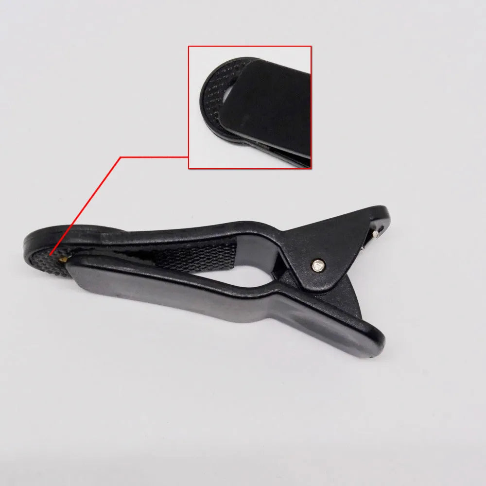 Silver 12x telephoto lens with black universal clip for attaching to a smartphone.