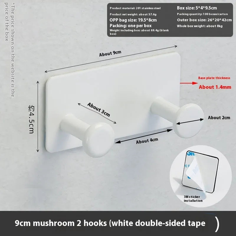 Black screwless adhesive wall hook with three hooks mounted on a glass shower door
