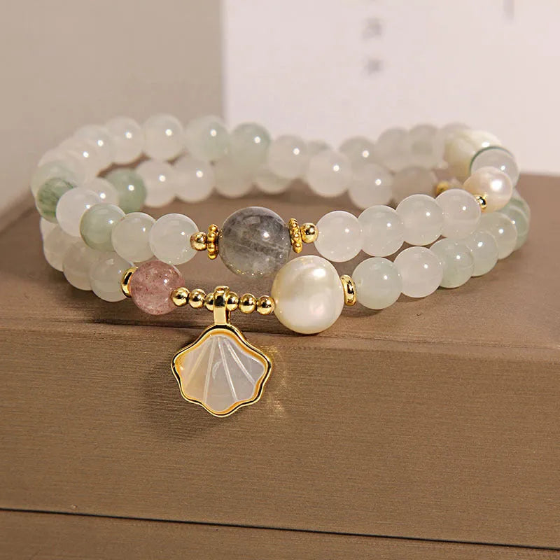 Women's Tianshan emerald green crystal bracelet with gold-plated apricot leaf pendant and rhinestones.
