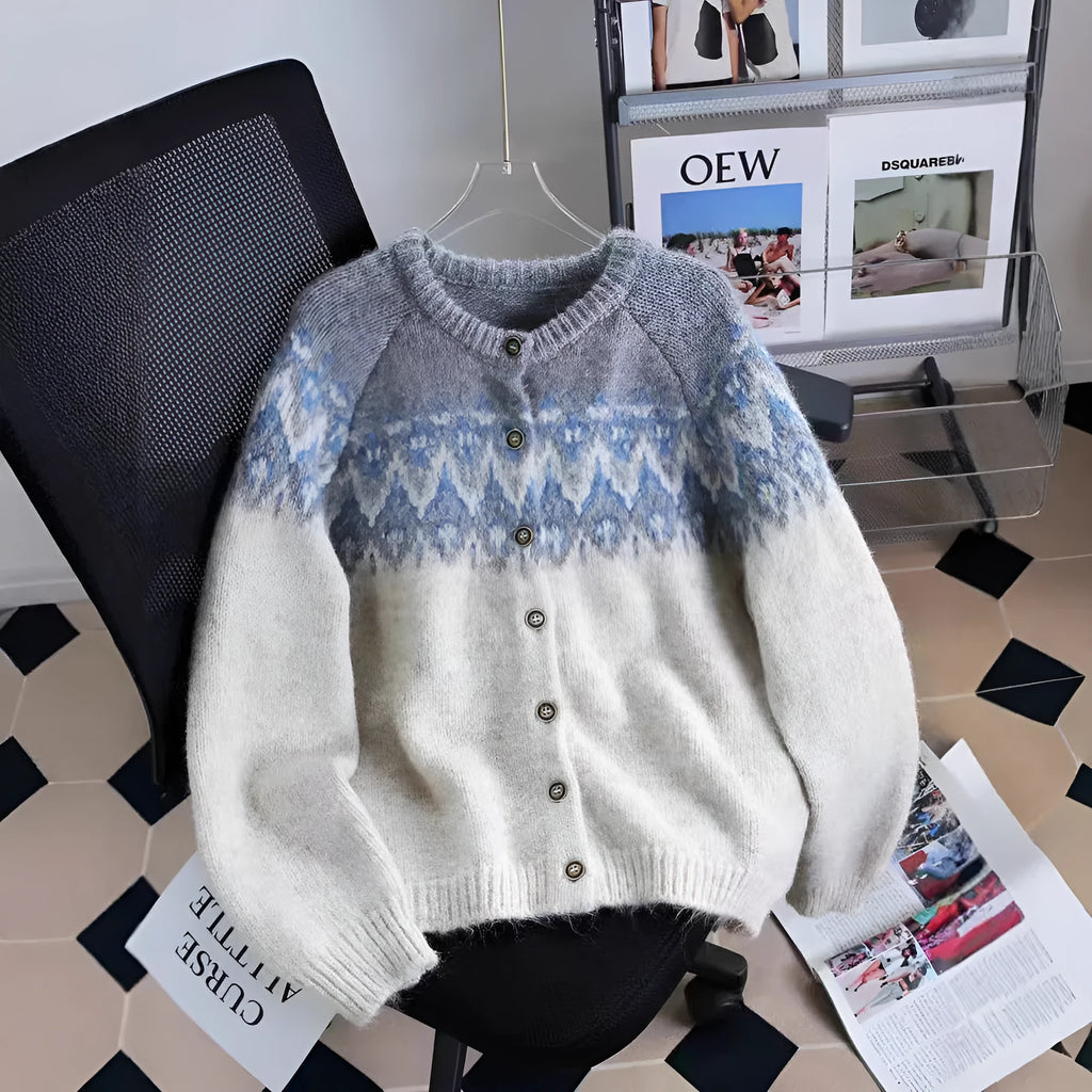 Women's loose fit jacquard knit sweater coat in contrast colours, showing long sleeves and textured pattern.