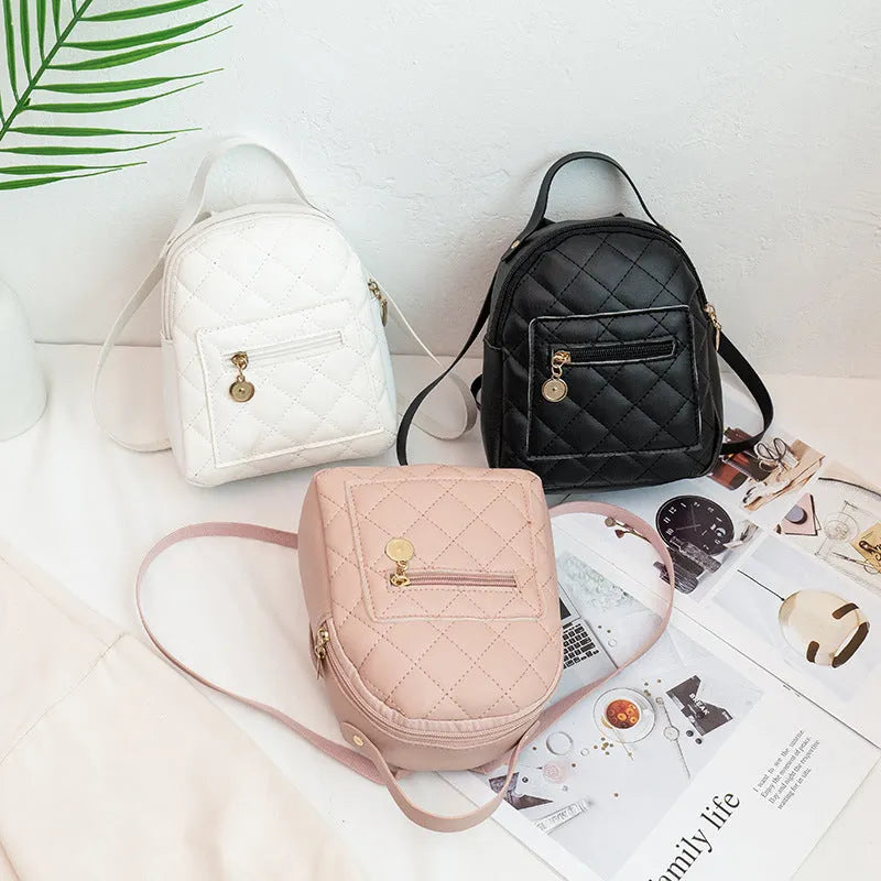 Hard shell white Korean style embroidered girls backpack with soft handle on a square background.