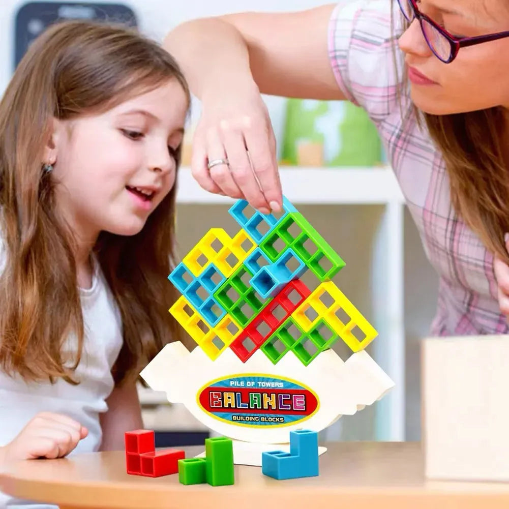 Plastic balance stacking game with colourful building blocks on chassis for family play