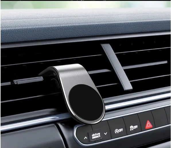 Black car bracket with rotatable ball joint plugged into a vehicle 12V socket