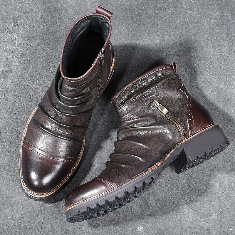 Black mid-calf cowboy boots with a side zipper, round toe, and a horseshoe heel on a plain background.