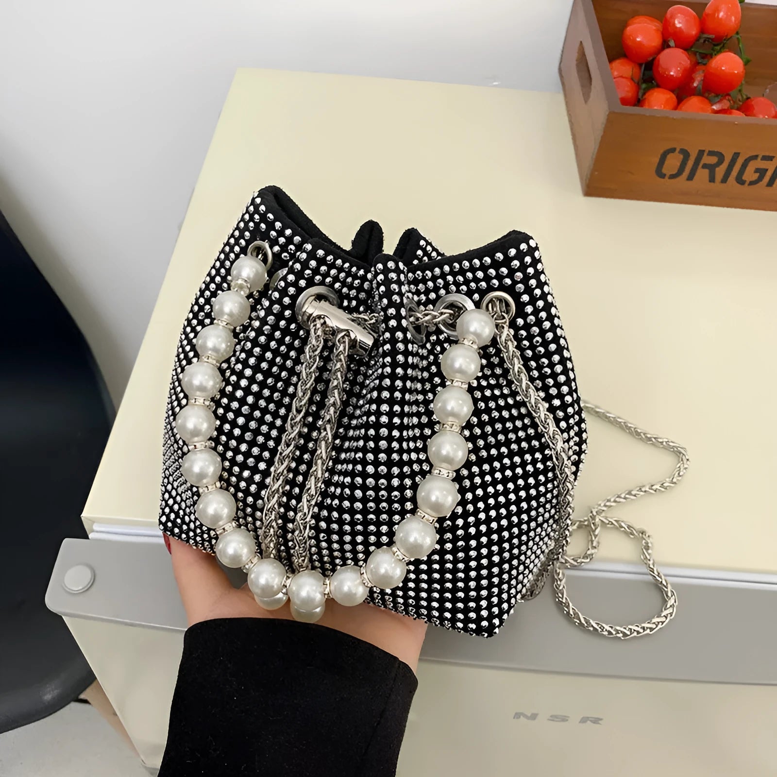 Soft PU leather crossbody bucket bag with diamond decorations and a chain shoulder strap.