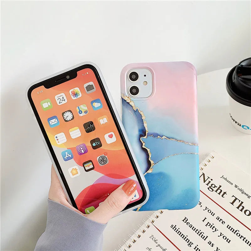 Cartoon marble pattern TPU back cover case for iPhone on a blue powder background.