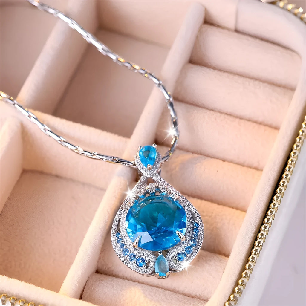 Geometric pendant necklace with blue crystal and water wave chain for women