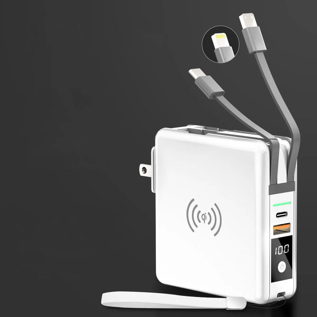 Black Super QI 10000mAh power bank with wireless charging top and foldable UK plug adapter attached.