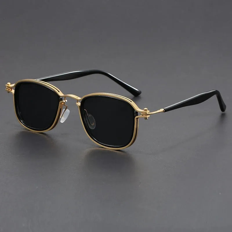 Retro square sunglasses with graphic lightning bolt design on black and gold frames.