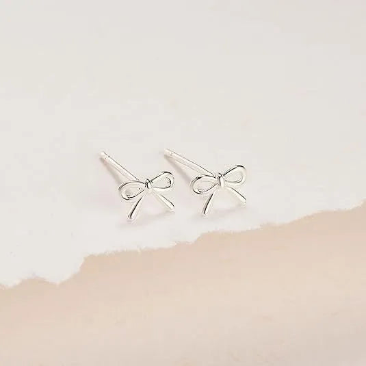 Women's gold and silver bow or cross stud earrings with geometric designs