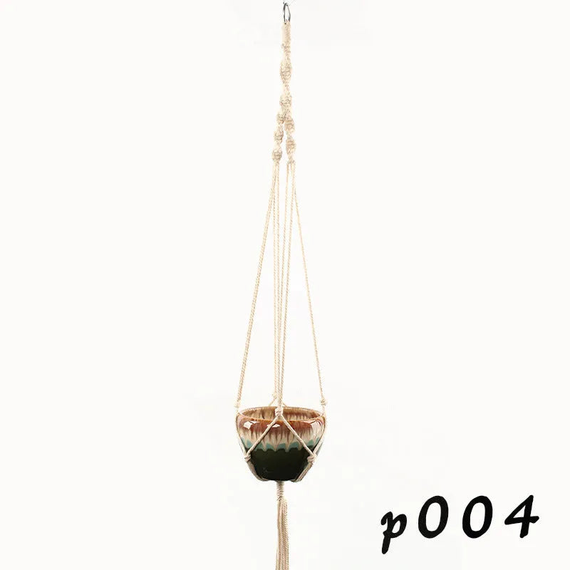A rustic-style woven cotton rope plant trellis panel supporting green leaves.