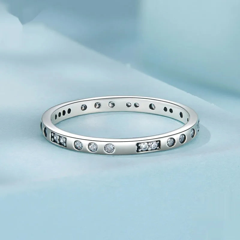 Oxidised black silver 'I Love You' moss code ring on a simple band for women.