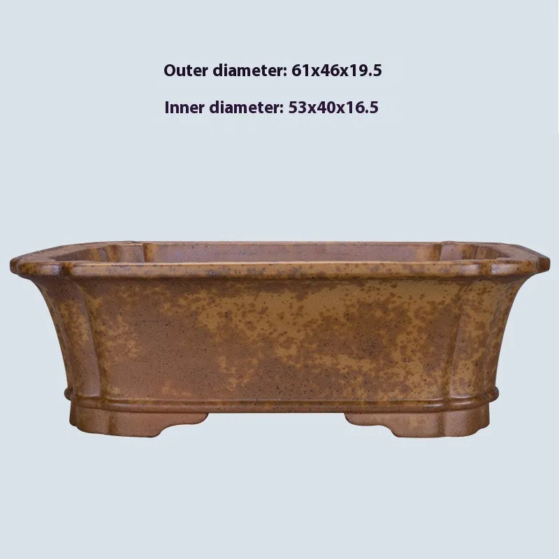 Large rectangular purple sand flowerpot on floor next to smaller size option.