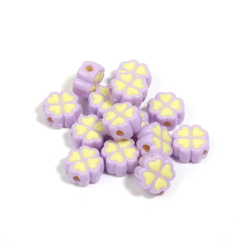 15mm acrylic clover craft beads with frosted finish in multiple colours including pink, blue, yellow, and green