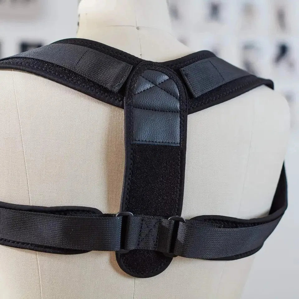 Black adjustable posture correction strap for back and shoulder support.