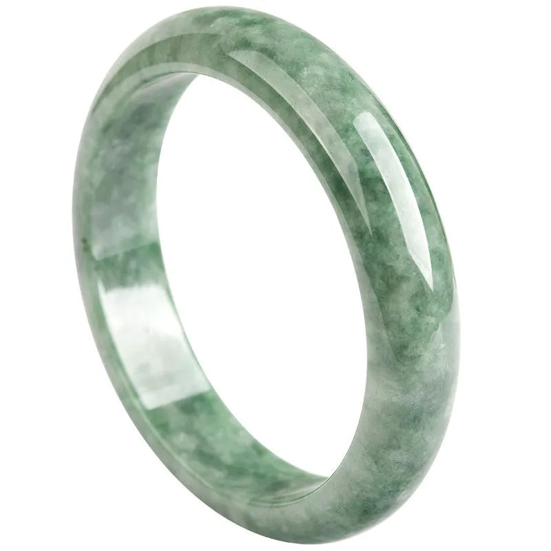 Natural deep pea green jade bangle bracelet for women on a gift box.