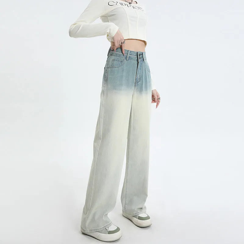 Women's gradient blue wide leg straight-leg denim trousers laid flat.