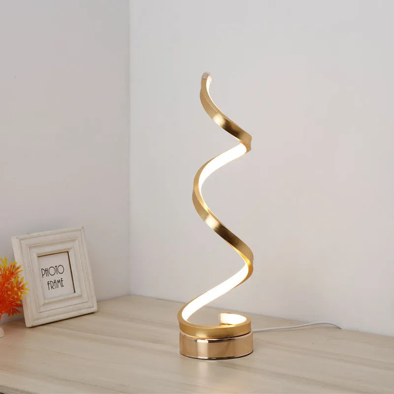 Minimalist black aluminium LED bedside table lamp on nightstand