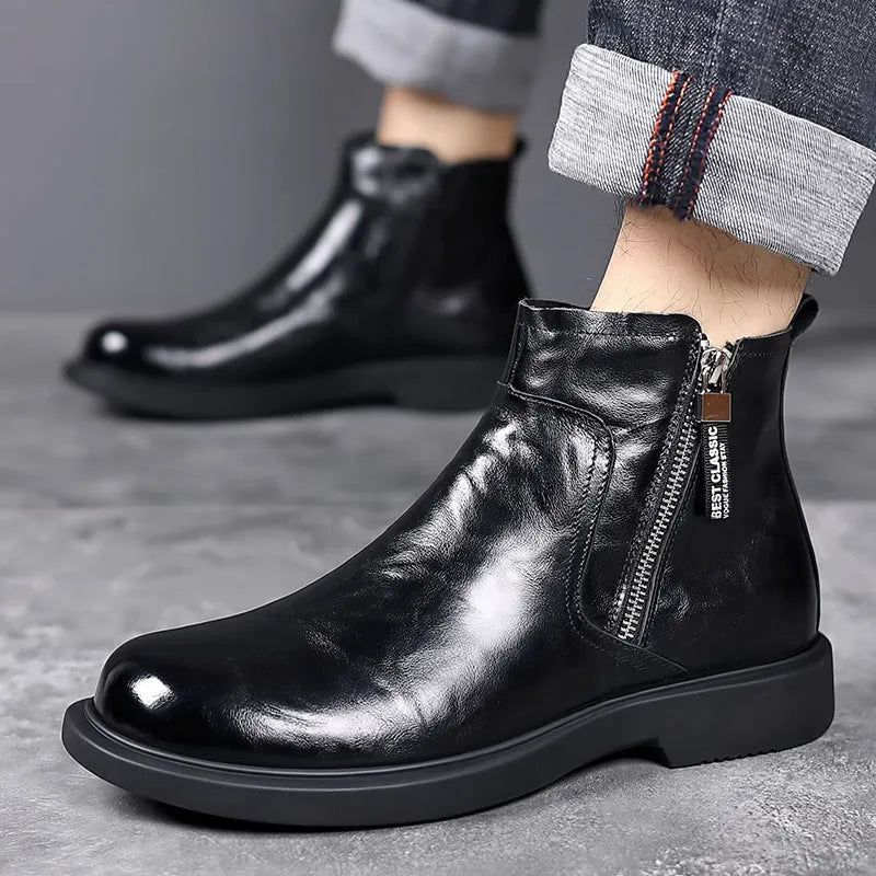 Men's brown and black genuine leather Chelsea boots with side zipper, mesh lining, low heel, and rubber sole.
